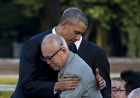 U.S. President Barack Obama hugs Shigeaki Mori (front), a survivor of the 1945 atomic bombing of Hiroshima, during a visit to the Hiroshima Peace Memorial Park May 27, 2016. (Photo by Jim Watson/AFP via Getty Images)