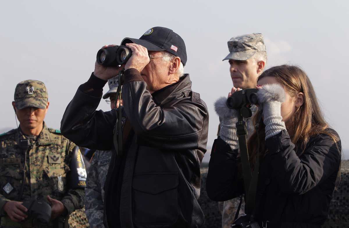 U.S. Vice President Joe Biden and his granddaughter Finnegan Biden look through binoculars toward North Korea during a visit to observation post Ouellette at the Demilitarized Zone (DMZ) on December 7, 2013 in Panmunjom, South Korea.  (Photo by Chung Sung-Jun/Getty Images)