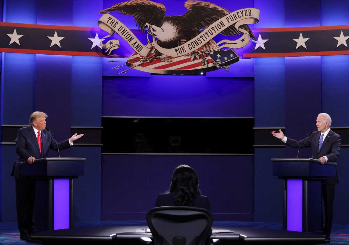 U.S. President Donald Trump (L), Democratic Presidential candidate former US Vice President Joe Biden and moderator, NBC News anchor, Kristen Welker (C) participate in the final presidential debate at Belmont University in Nashville, Tennessee, on October 22, 2020. (Photo by Chip Somodevilla / POOL / AFP)