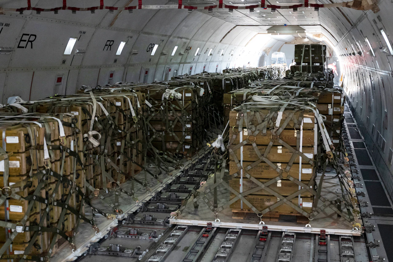 Pallets of ammunition bound for Ukraine are secured onto a commercial plane during a security assistance mission at Dover Air Force Base, Del., July 21, 2022. (Photo: Air Force Senior Airman Faith Schaefer)