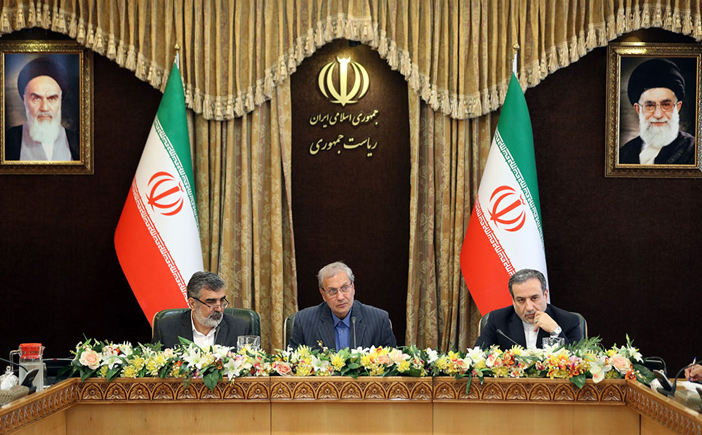Iran's Atomic Energy Organisation spokesman Behrouz Kamalvandi (left), government spokesman Ali Rabiei (center), and Deputy Foreign Minister Abbas Araghchi (right) give a joint press conference in Tehran as Iran prepares to  begin enriching uranium beyond a 3.67 percent cap set by the 2015 landmark nuclear deal, July 7, 2019. (Photo: HAMED MALEKPOUR/AFP via Getty Images)